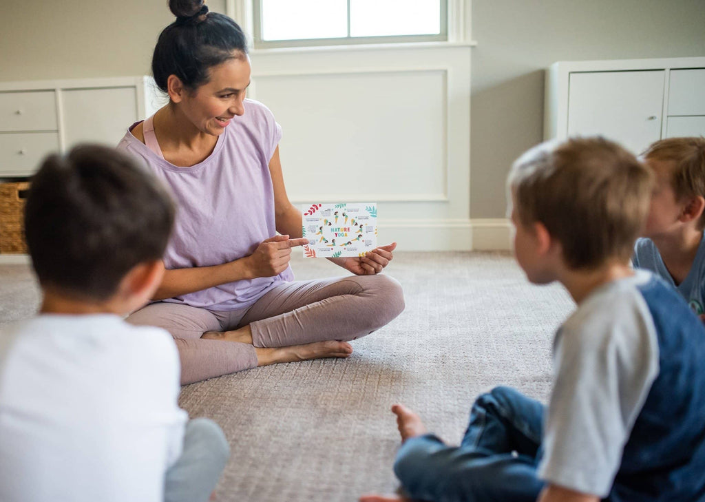 Mother explaining kid's nature yoga.